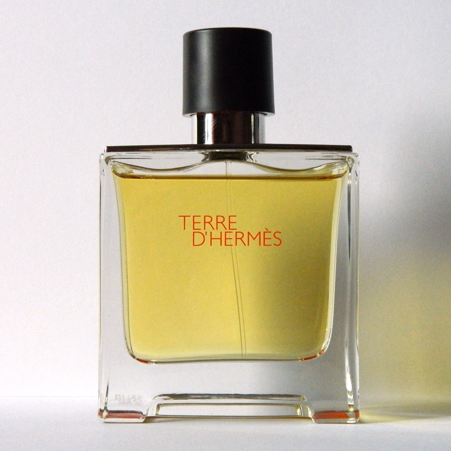 A bottle silhouette on warm paper