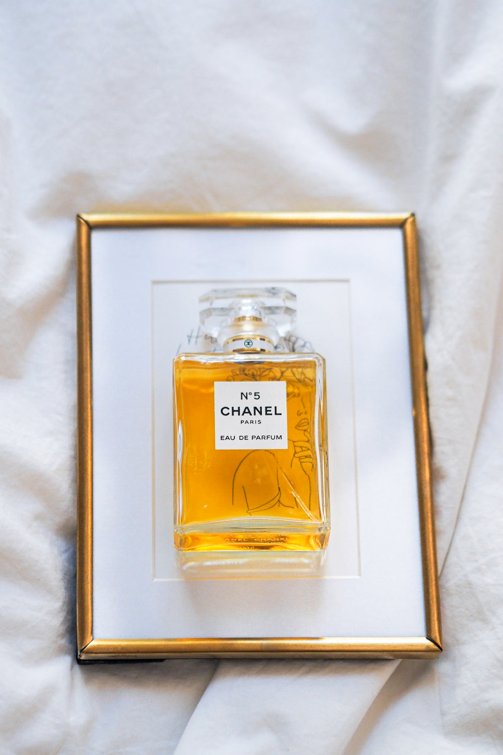 A perfume bottle in warm studio light